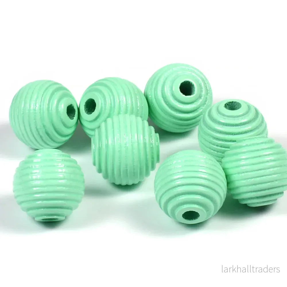 Räfflade träpärlor, 14mm, mint, 16st Räfflade träpärlor, 14mm, mint, 16st