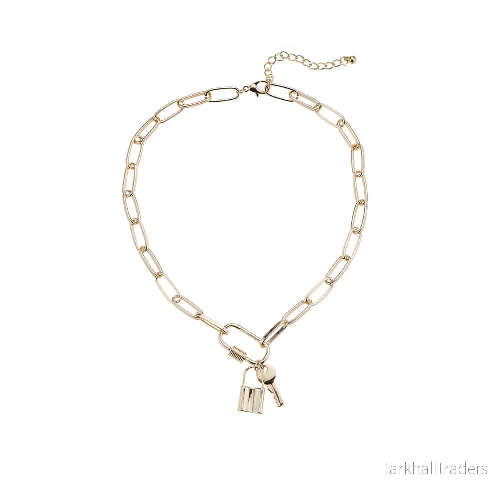 Halsband i guldfärg, hänglås och nyckel som hänge Halsband i guldfärg, hänglås och nyckel som hänge