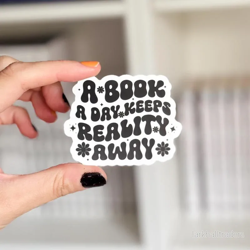 Vinyl sticker – A book a day keeps reality away | Svartvit Vinyl sticker – A book a day keeps reality away | Svartvit