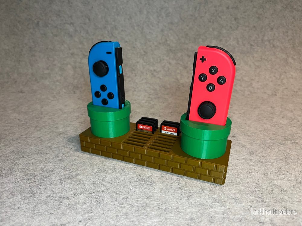 Super Mario-inspirerat ställ för Joy-Con och 16 Nintendo Switch-spel Super Mario-inspirerat ställ för Joy-Con och 16 Nintendo Switch-spel
