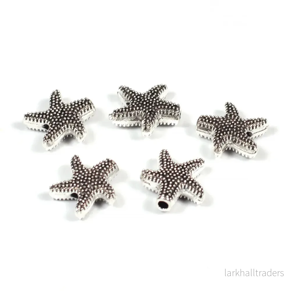 Metallpärlor, sjöstjärnor, antiksilver, 10mm, 10st