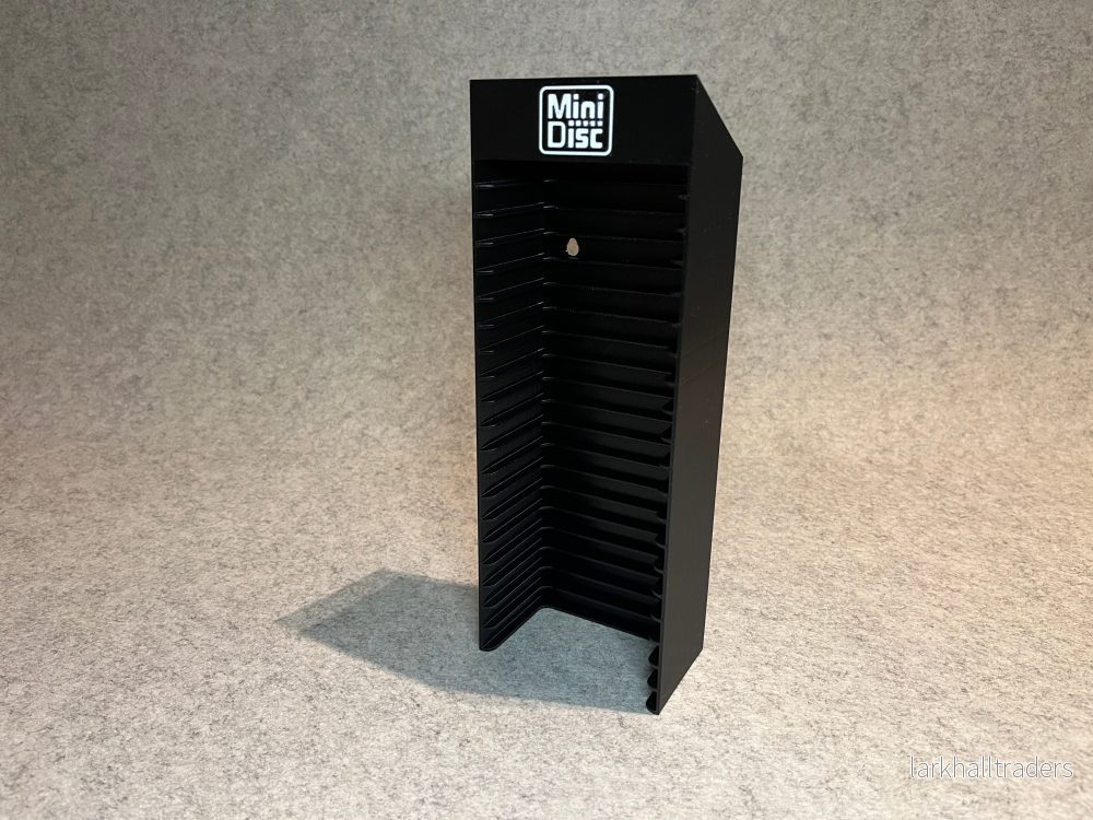 Vägghållare / ställ för 20 MiniDisc-skivor med MD-logotyp