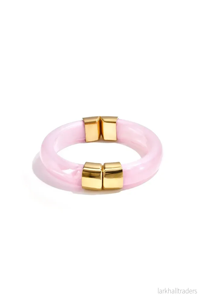 Armband i akryl med guldfärgade detaljer