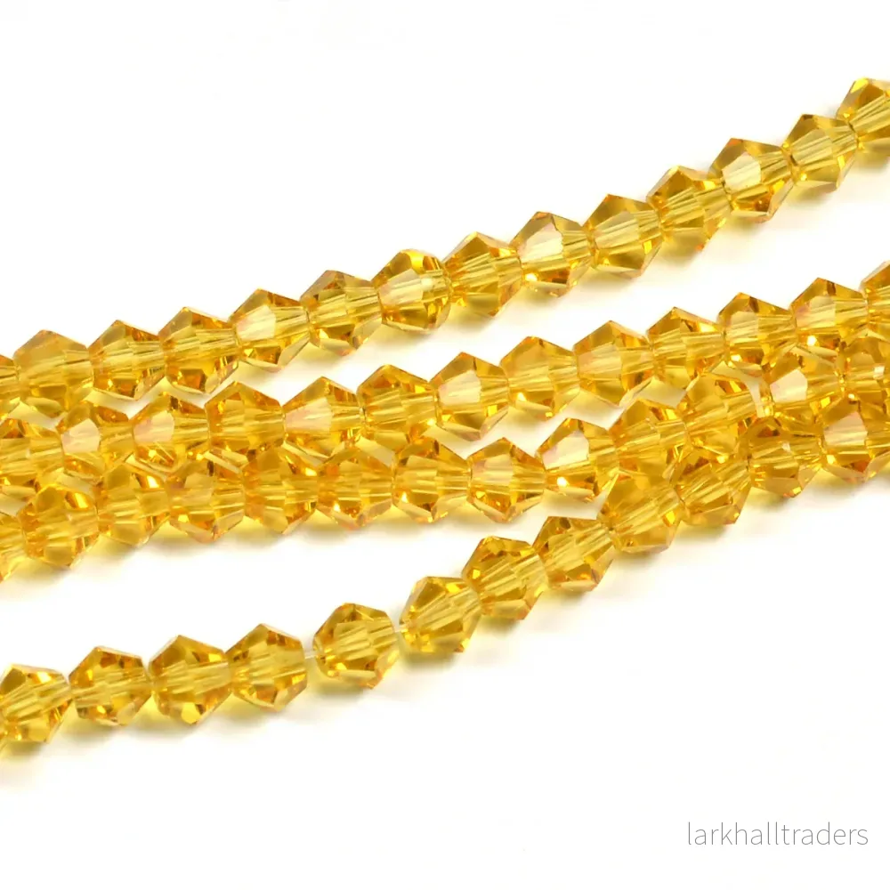 Bicone glaspärlor, guld, 4mm